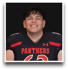 A person with short dark hair is smiling and wearing a black football jersey with red accents and the word Panthers across the chest. Description generated by AI
