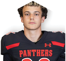 A young man wearing a white jersey with the number 10 on it. Description generated by AI