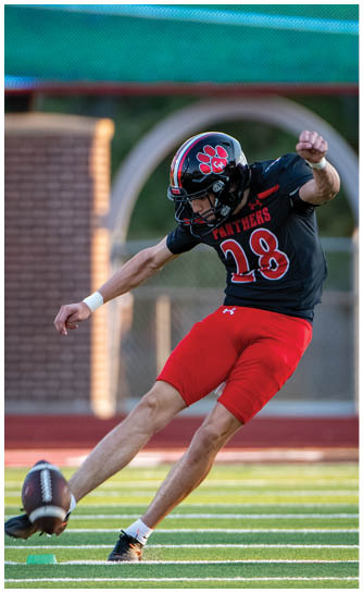 A football player running on the field. Description generated by AI
