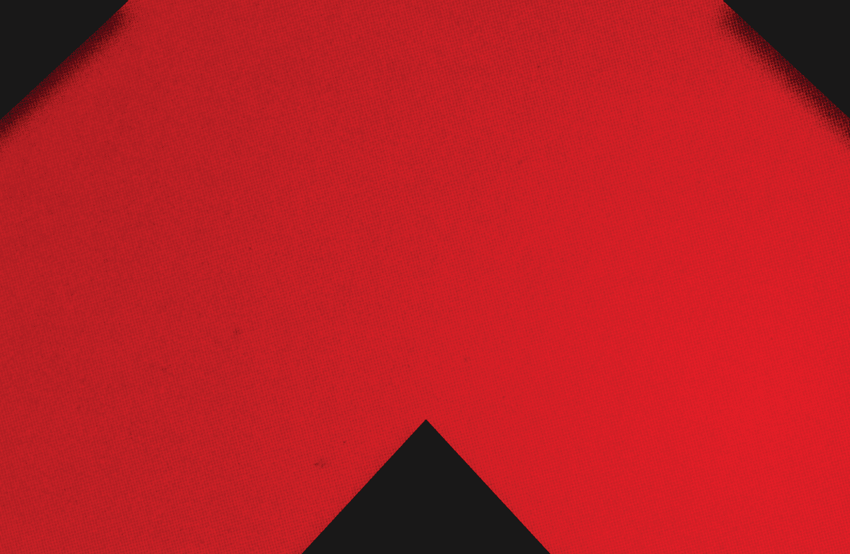 A red and black triangle. Description generated by AI