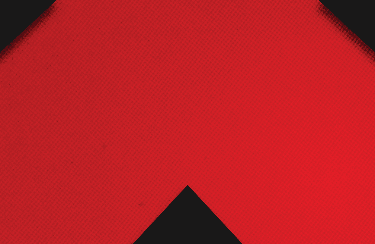 A red and black triangle. Description generated by AI
