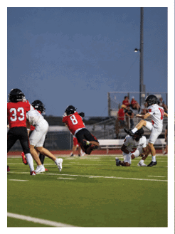 Two football players wearing black jerseys and holding hands. Description generated by AI
