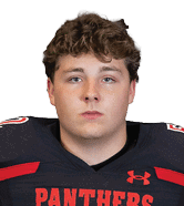 A person with curly hair wearing a black football jersey with red accents and the word “PANTHERS" on the front is looking directly at the camera. Description generated by AI