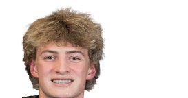 Person with curly hair wearing a black football jersey with the number 21 and the word Panthers on the front. Description generated by AI