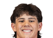 A person with short dark hair is smiling and wearing a red football jersey with the word Panthers and the number 8 on it. Description generated by AI