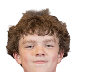 A person with curly hair wearing a red football jersey with the word Panthers and the number 32 on it is looking forward with a slight smile. Description generated by AI