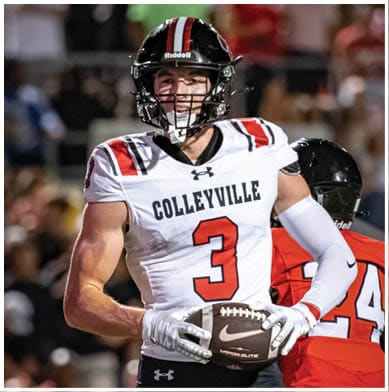 A person wearing a white football uniform with the number 3 and the word Colleyville is holding a football on a field with a crowd in the background. Description generated by AI