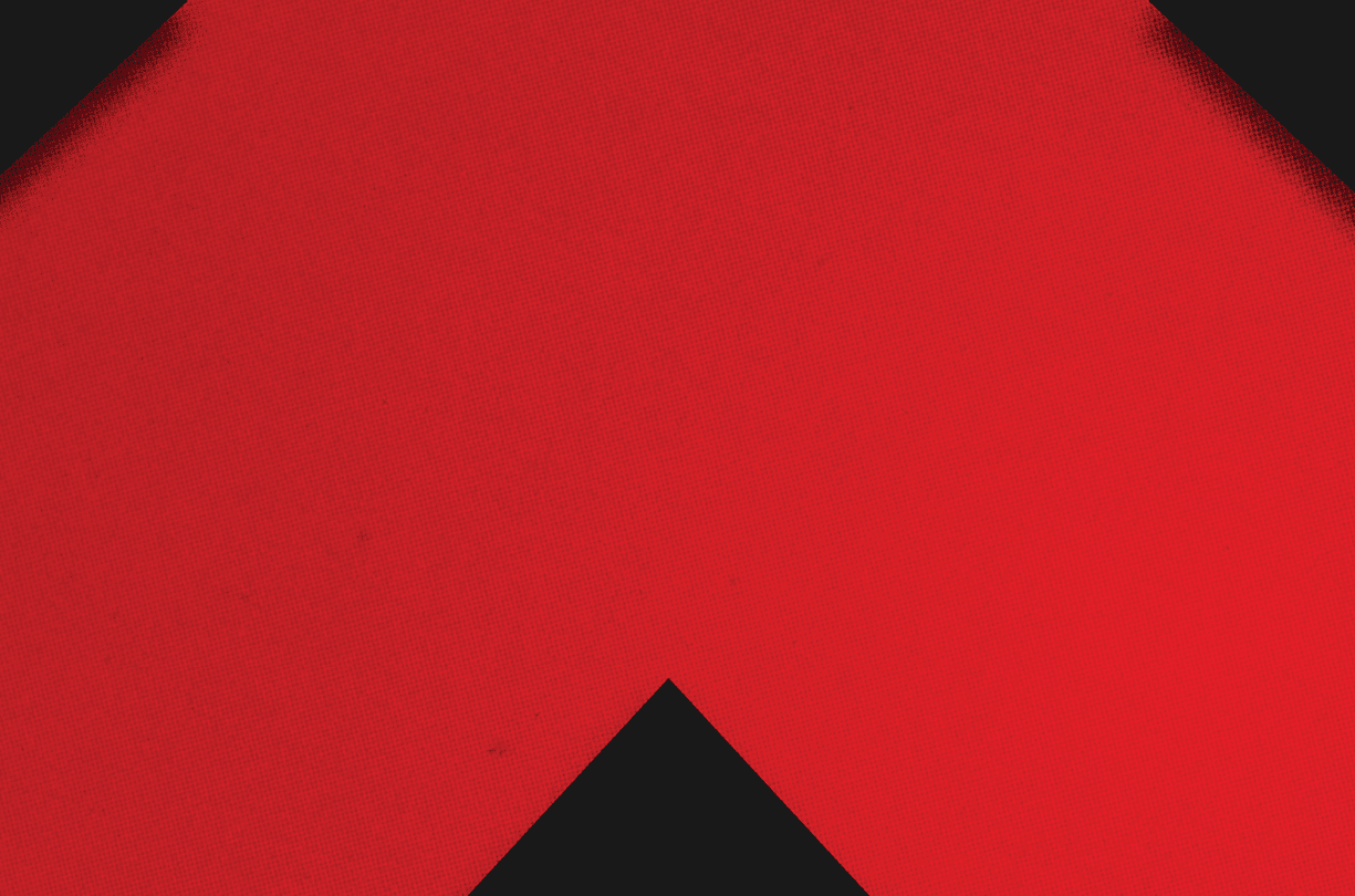 A red and black triangle. Description generated by AI