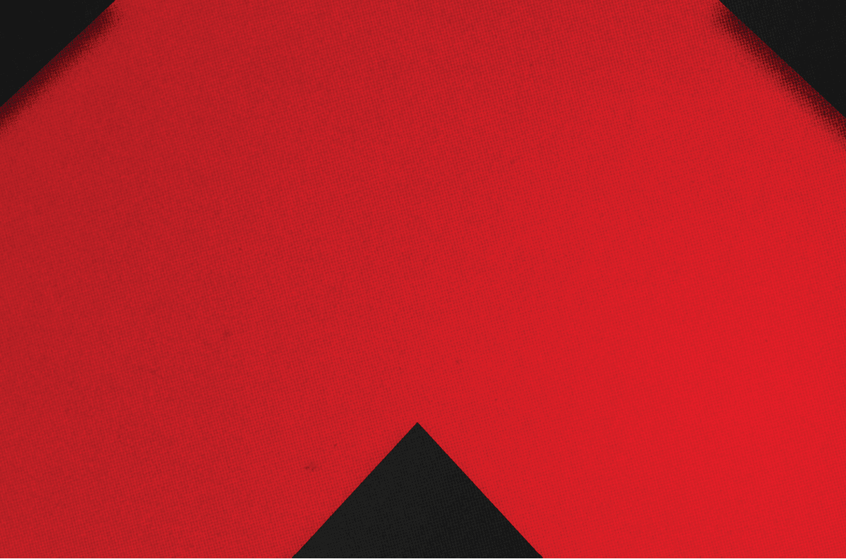 A red and black triangle. Description generated by AI
