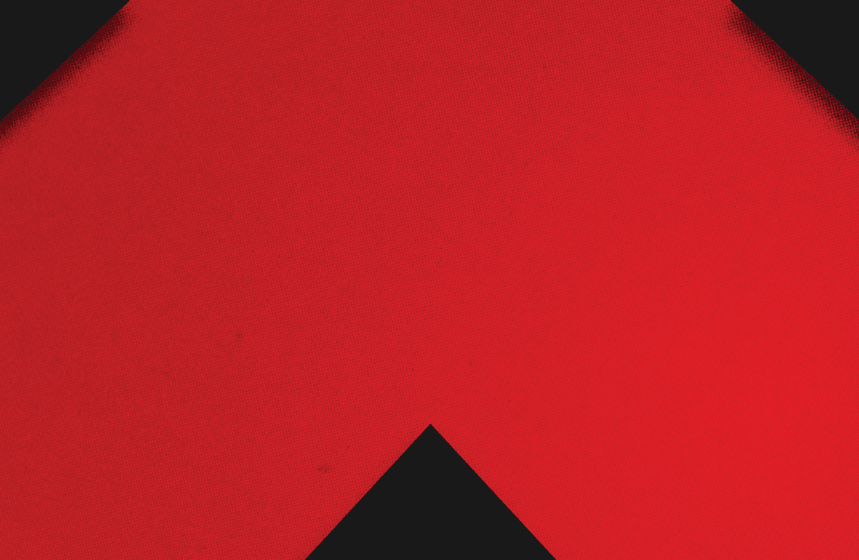 A red and black triangle. Description generated by AI