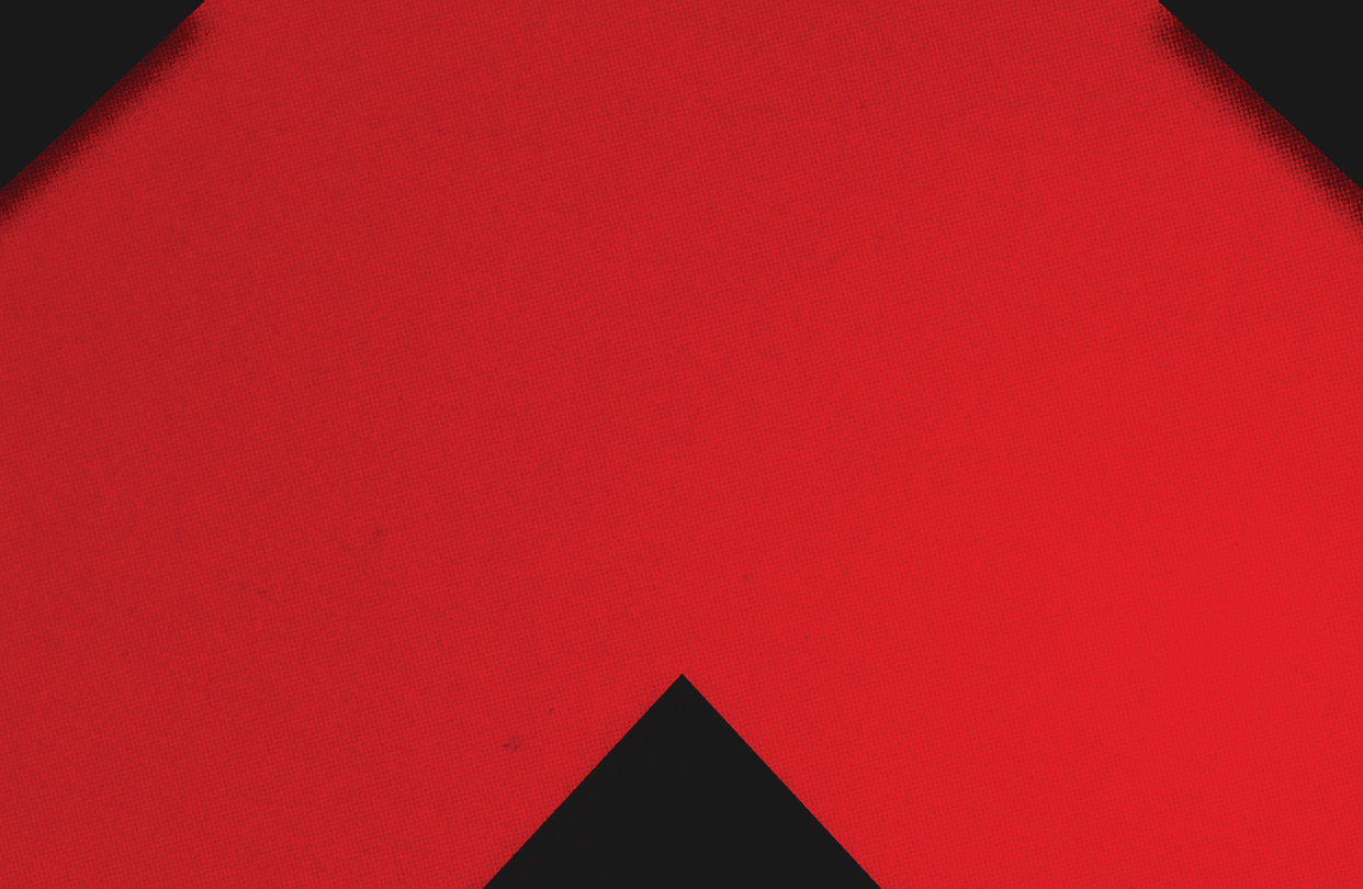 A red and black triangle. Description generated by AI