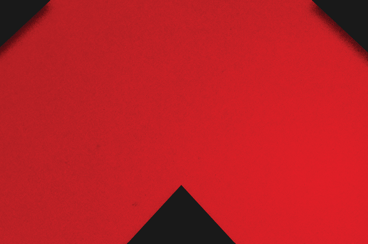 A red and black triangle. Description generated by AI
