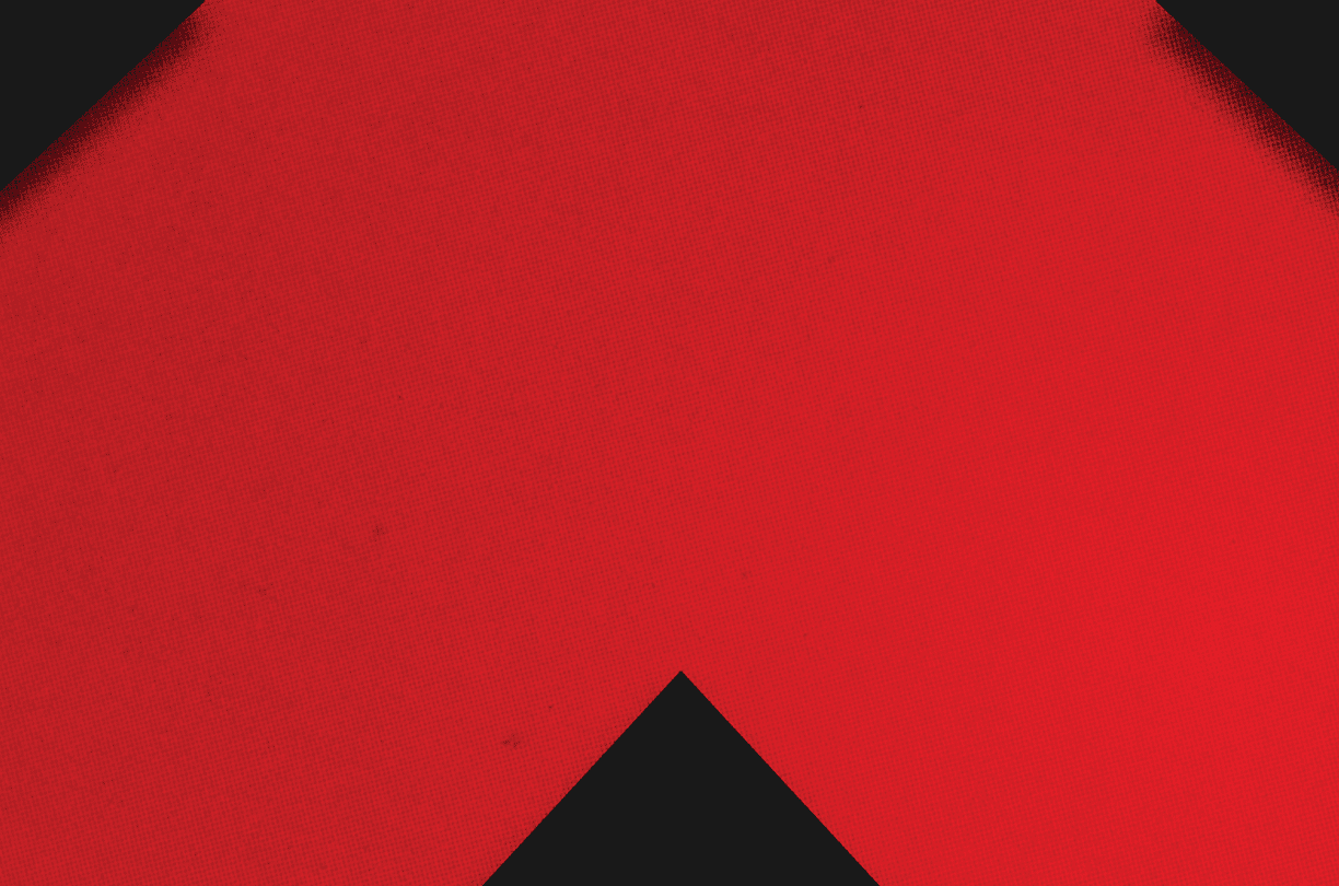 A red and black triangle. Description generated by AI