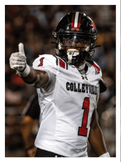 Two football players wearing black jerseys and holding hands. Description generated by AI