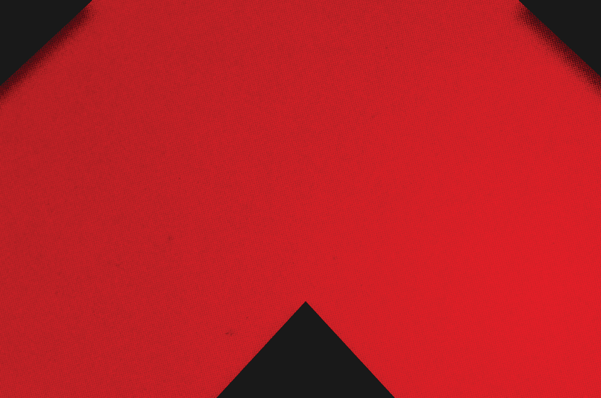 A red and black triangle. Description generated by AI