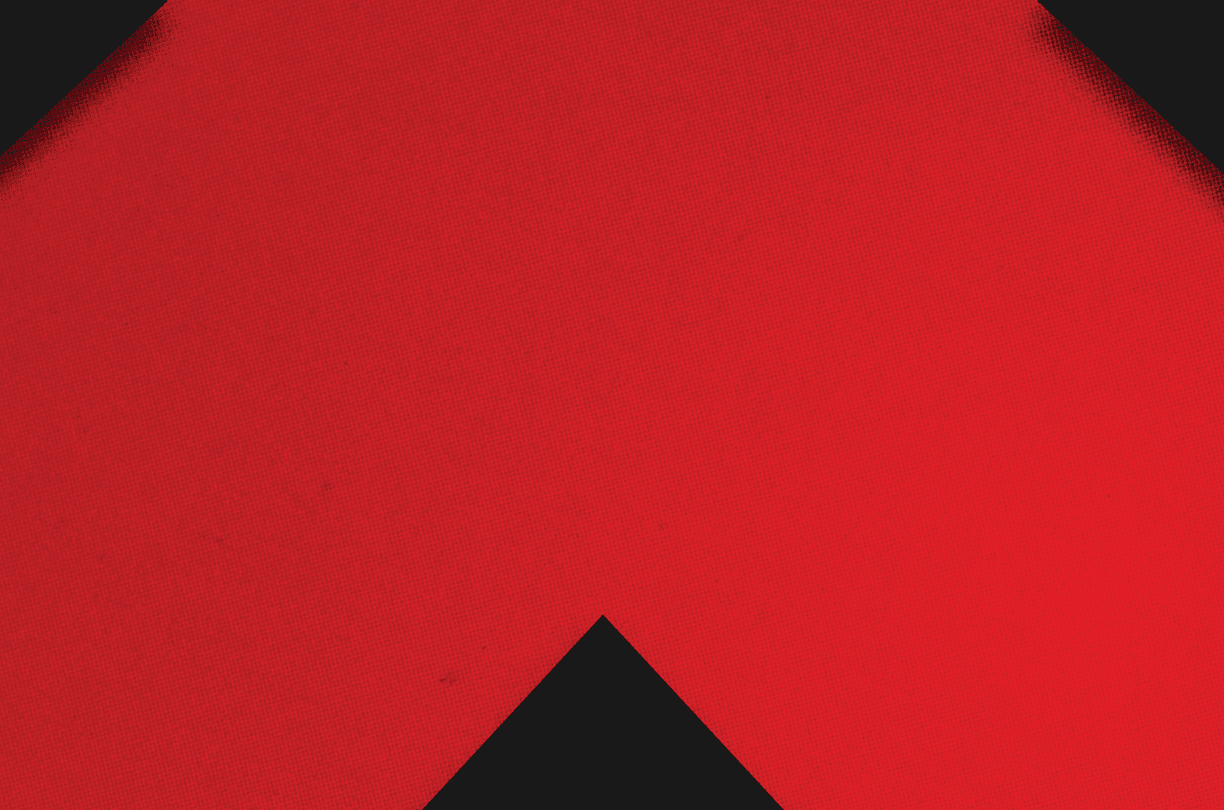 A red and black triangle. Description generated by AI