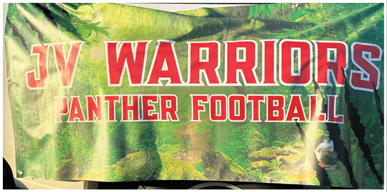 A green banner with red and white text reads JV Warriors Panther Football against a leafy background. Description generated by AI