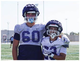 A group of football players on a field. Description generated by AI