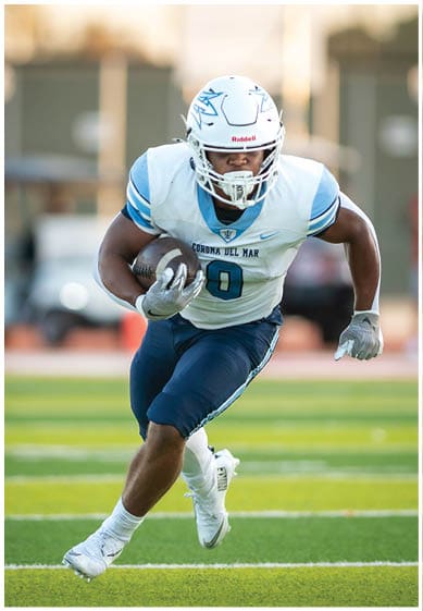 A football player wearing a blue jersey with the number 58 on it. Description generated by AI