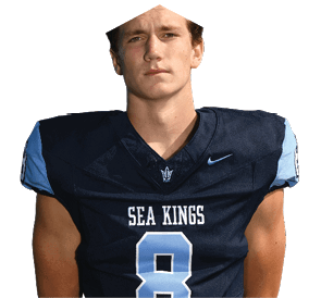 A young man wearing a white jersey with the number 10 on it. Description generated by AI
