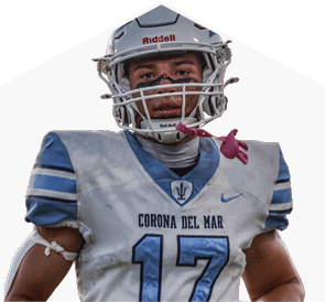 A young man wearing a white jersey with the number 10 on it. Description generated by AI