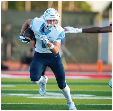 A football player wearing a blue jersey with the number 58 on it. Description generated by AI