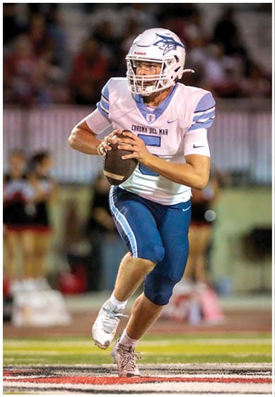 A football player wearing a blue jersey with the number 58 on it. Description generated by AI
