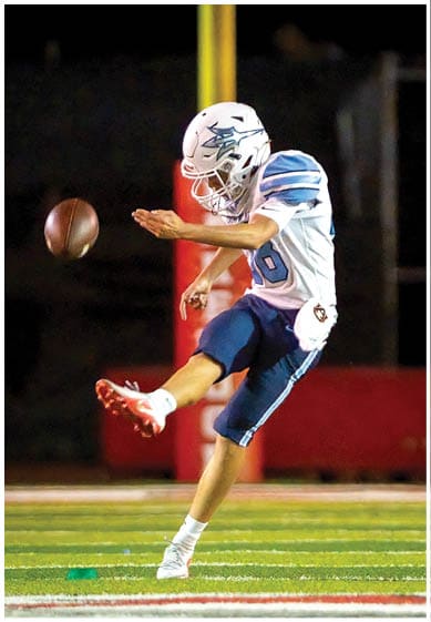 A football player wearing a blue jersey with the number 58 on it. Description generated by AI