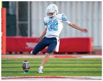 A football player is sliding on the ground. Description generated by AI