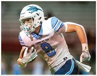 A football player is sliding on the ground. Description generated by AI