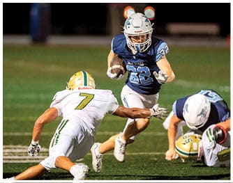 A football player is sliding on the ground. Description generated by AI