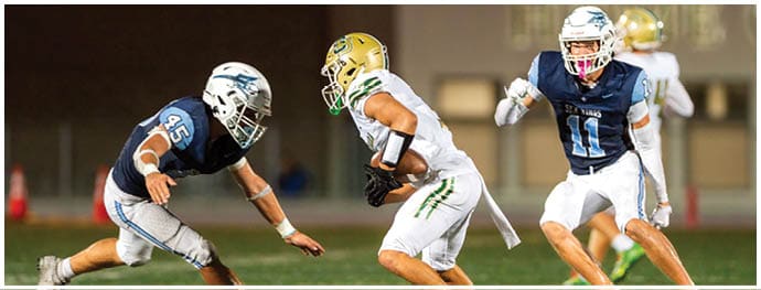 A football player is sliding on the ground. Description generated by AI