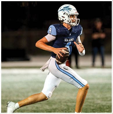 A football player running on the field. Description generated by AI