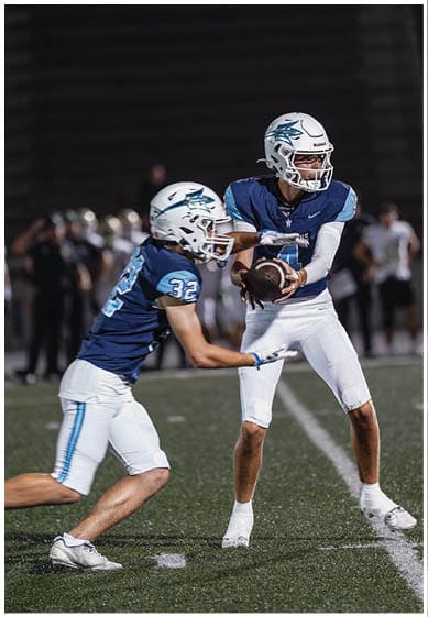 A football player wearing a blue jersey with the number 58 on it. Description generated by AI