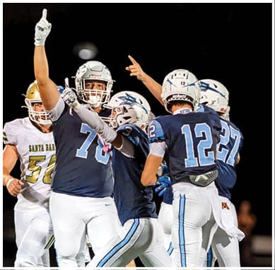 A football player wearing a blue jersey with the number 58 on it. Description generated by AI