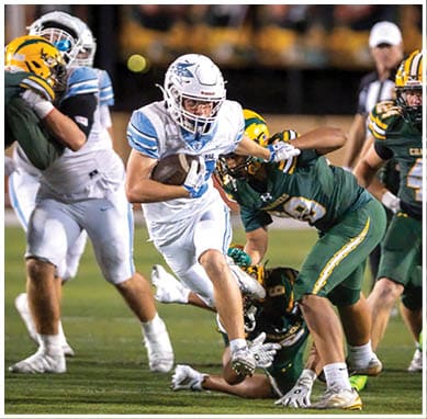 A football player wearing a blue jersey with the number 58 on it. Description generated by AI