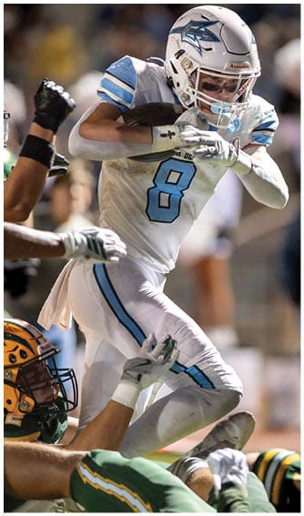A football player running on the field. Description generated by AI