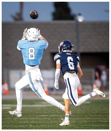 A football player wearing a blue jersey with the number 58 on it. Description generated by AI