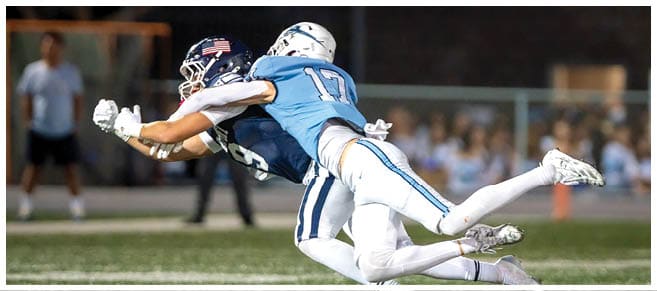 A football player wearing a blue jersey with the number 58 on it. Description generated by AI