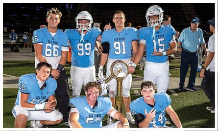 A football player wearing a blue jersey with the number 58 on it. Description generated by AI