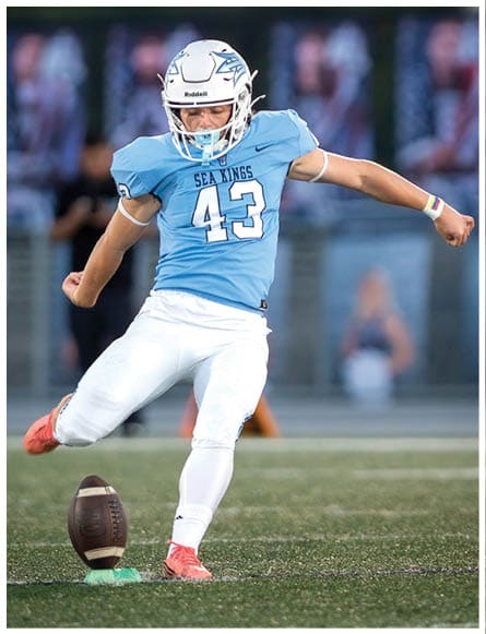 A football player running on the field. Description generated by AI