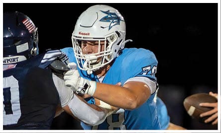 A football player wearing a blue jersey with the number 58 on it. Description generated by AI