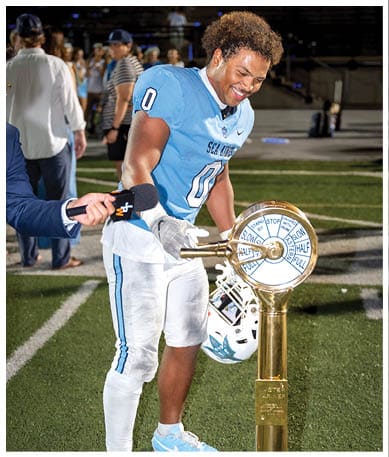 A football player wearing a blue jersey with the number 58 on it. Description generated by AI