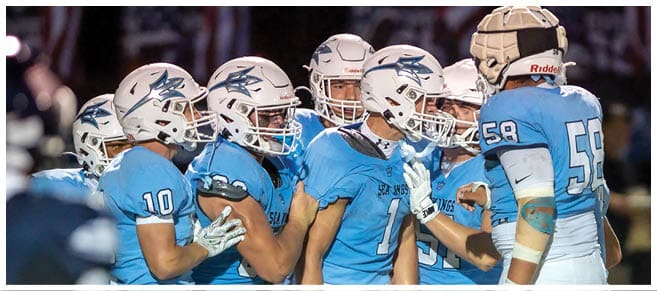 A football player wearing a blue jersey with the number 58 on it. Description generated by AI