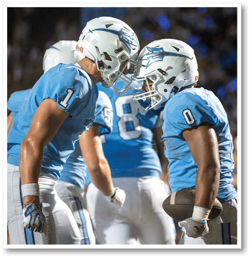 A group of men wearing black and white jerseys. Description generated by AI