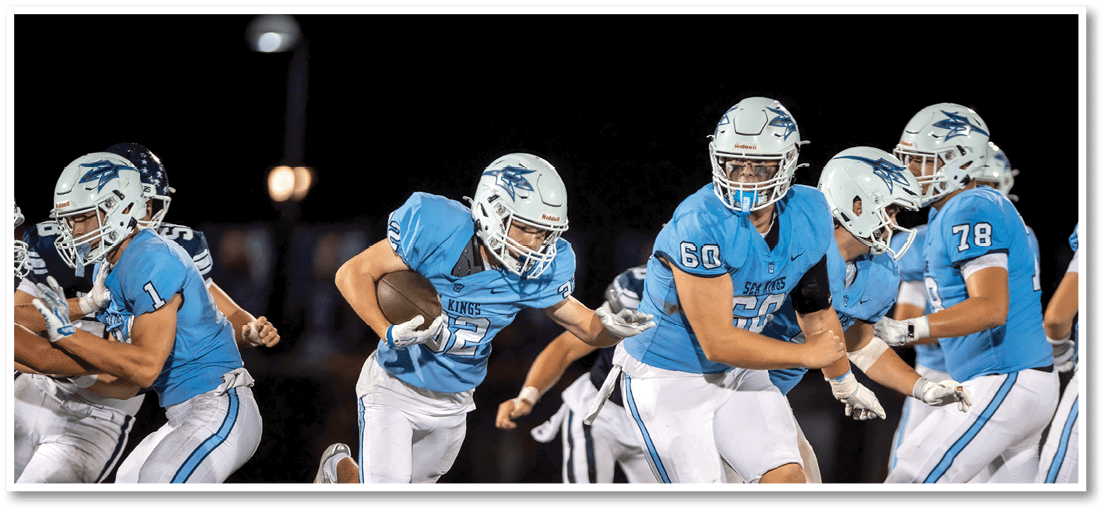 A football player running on the field. Description generated by AI