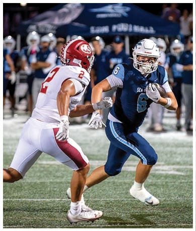 A football player wearing a blue jersey with the number 58 on it. Description generated by AI