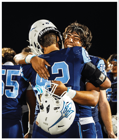 A football player wearing a blue jersey with the number 58 on it. Description generated by AI