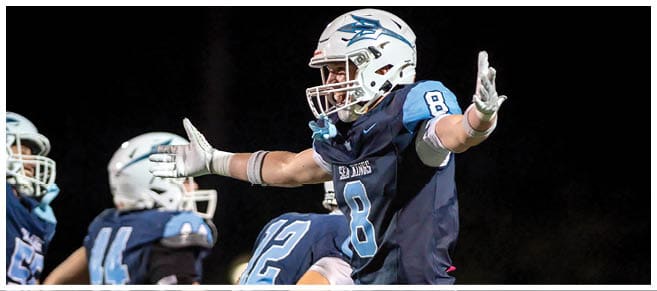 A football player wearing a blue jersey with the number 58 on it. Description generated by AI