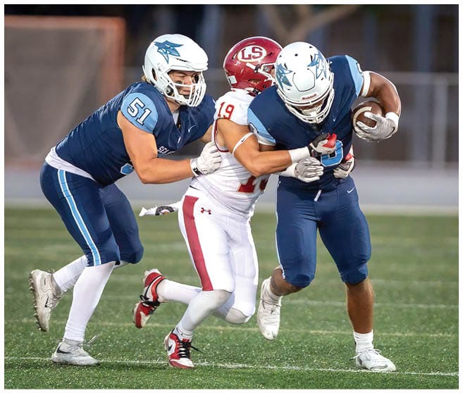 A football player wearing a blue jersey with the number 58 on it. Description generated by AI